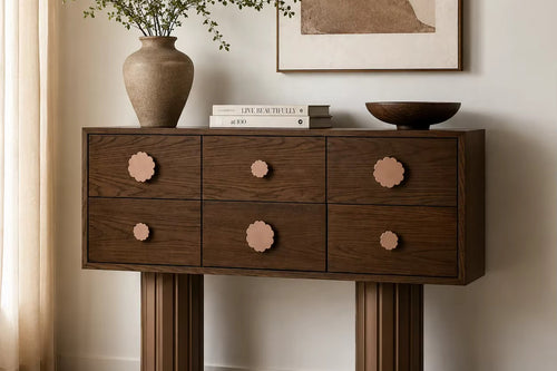 Hutch Storage Console featuring six wooden drawers with playful flower-shaped knobs and sculptural fluted legs, designed as a functional statement piece for contemporary interiors.