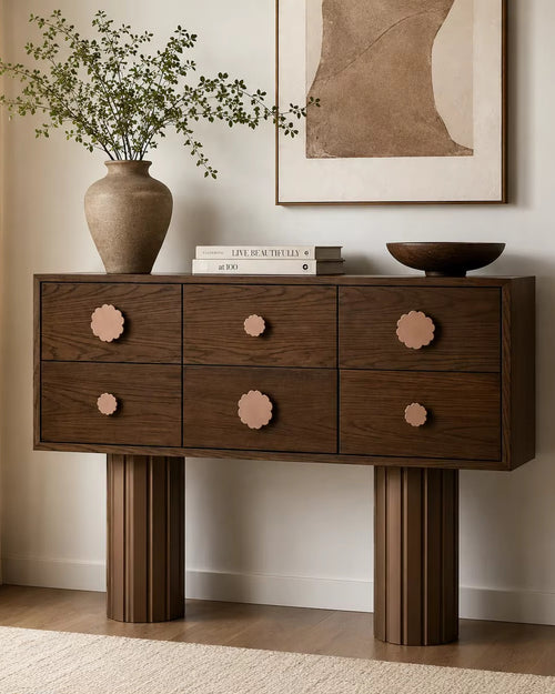 Hutch Storage Console featuring six wooden drawers with playful flower-shaped knobs and sculptural fluted legs, designed as a functional statement piece for contemporary interiors.