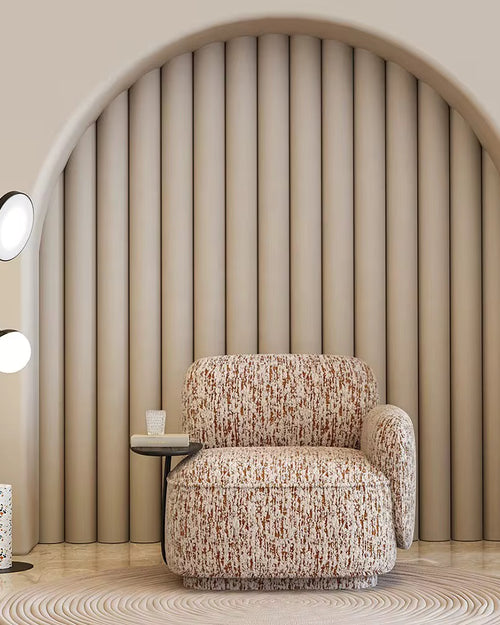 Discover the Reiha Chair by Chair Collective — a plush modern chair with abstract fabric and built-in wooden side table. Shop luxury accent chairs online in India.