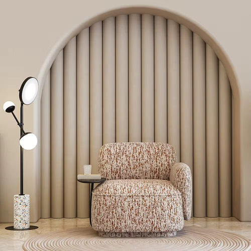 Discover the Reiha Chair by Chair Collective — a plush modern chair with abstract fabric and built-in wooden side table. Shop luxury accent chairs online in India.