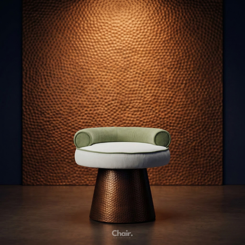 Modern chair with green cushioned backrest and white seat against a textured brown wall.