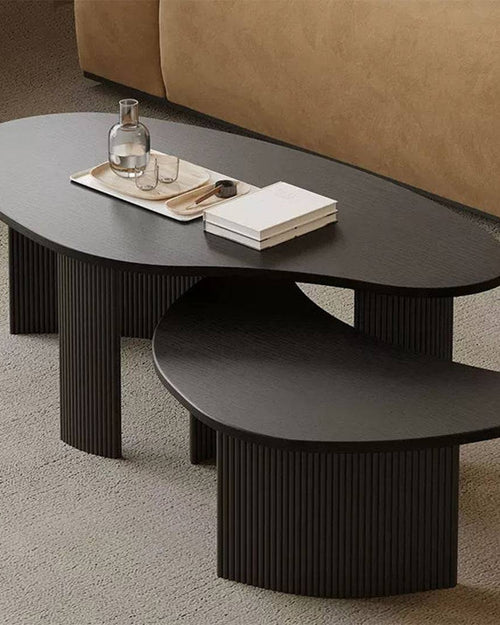 Shelby black coffee tables with oval tops side profile