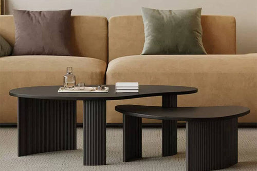 Two Shelby contemporary black oval coffee tables with fluted base
