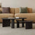 Two Shelby contemporary black oval coffee tables with fluted base