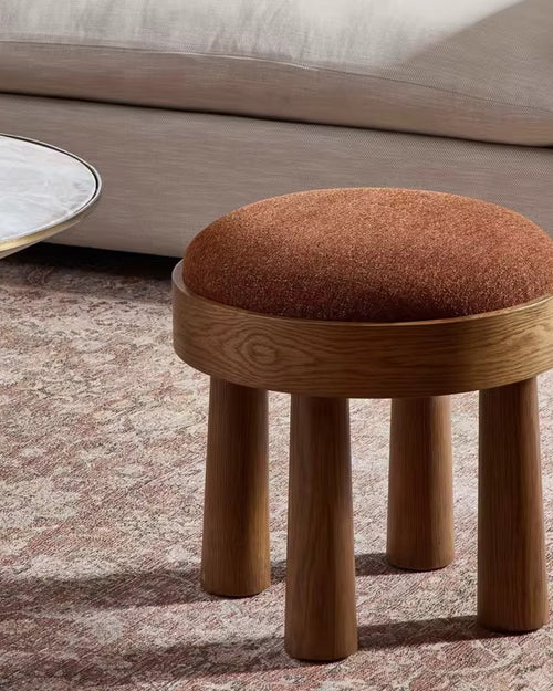 A handcrafted solid wood pouf available in Teak or White Ash, designed in pure Japandi style with a soft upholstered seat. The Shuay Luxury Pouf is ideal for living rooms, bedrooms, entryways, and modern minimalist homes. Shop luxury poufs and stools online in India at Chair Collective.