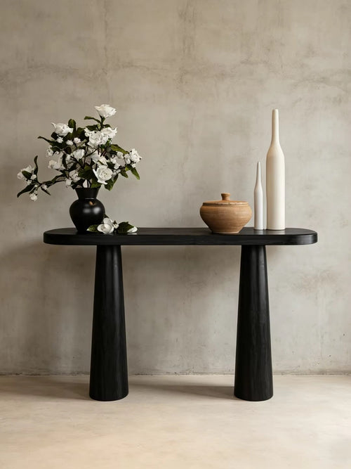 Modern 40-inch foyer console featuring a refined veneer top and sculptural black-finished legs, designed for compact entryways and contemporary interiors.