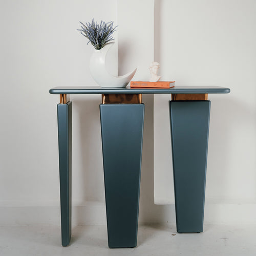 Terra console with asymmetrical legs and gold trim.
