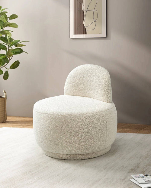 A close-up view of the Terry  Low-Back Armchair