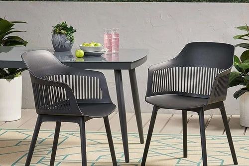 Pair of black Toit chairs with a matching table 