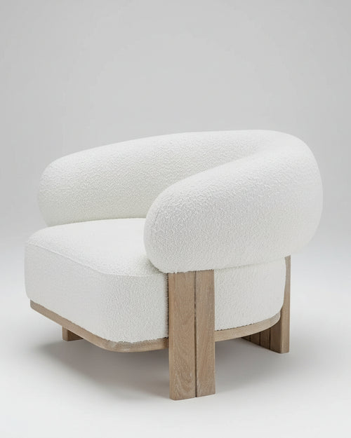 Experience the Tomo Luxury Accent Chair by Chair Collective, crafted in oak or teak with bouclé upholstery. A modern statement chair for elegant living rooms and luxury interiors.