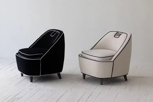 Black and cream piped lounge chairs pair