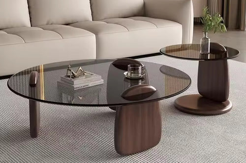 Turkke coffee table with glass top and sculptural wooden base
