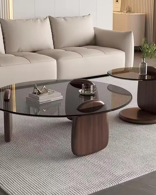 Turkke coffee table with glass top and sculptural wooden base