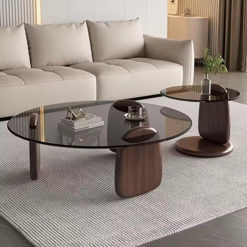 Turkke coffee table with glass top and sculptural wooden base