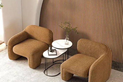 Two low-profile Twink Barrel Chairs 