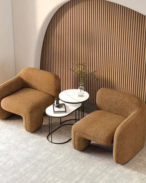 Two low-profile Twink Barrel Chairs 