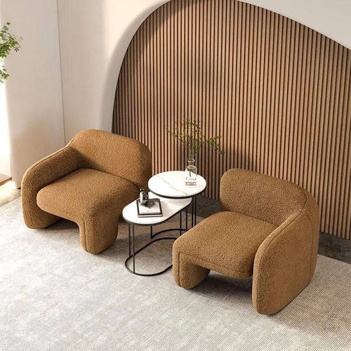 Two low-profile Twink Barrel Chairs 