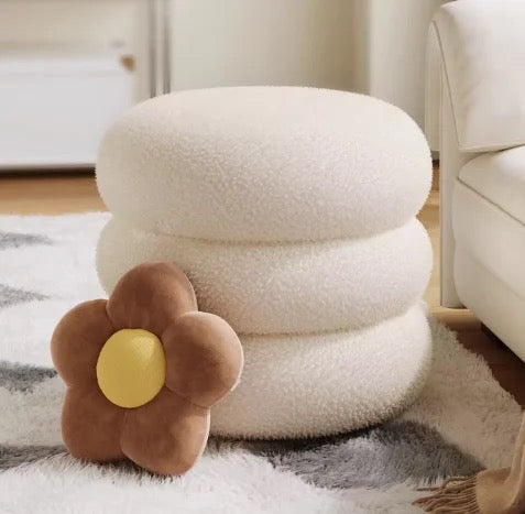 Unio Pouf in white, showing elegant ring design