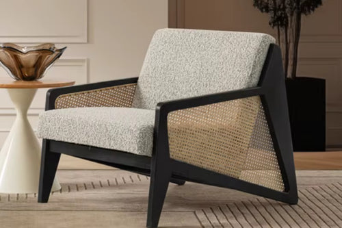 Discover the Vymo Chair by Chair Collective — a luxury modern chair crafted with teak frame, handwoven rattan, and soft upholstery. Shop this contemporary accent chair online in India, perfect for elegant living spaces.