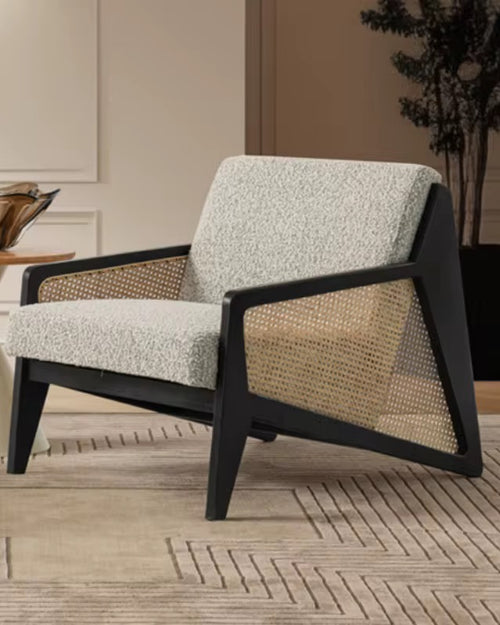 Discover the Vymo Chair by Chair Collective — a luxury modern chair crafted with teak frame, handwoven rattan, and soft upholstery. Shop this contemporary accent chair online in India, perfect for elegant living spaces.
