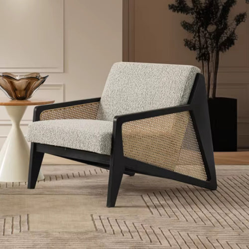 Discover the Vymo Chair by Chair Collective — a luxury modern chair crafted with teak frame, handwoven rattan, and soft upholstery. Shop this contemporary accent chair online in India, perfect for elegant living spaces.