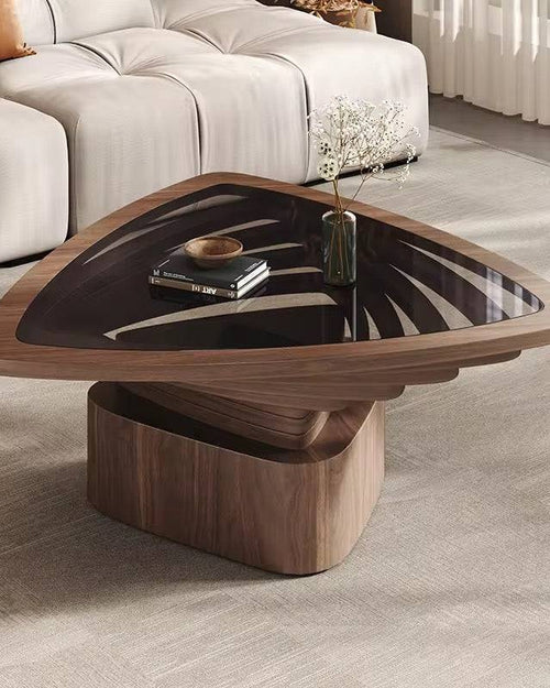 Modern wooden coffee table with a glass top in a living room