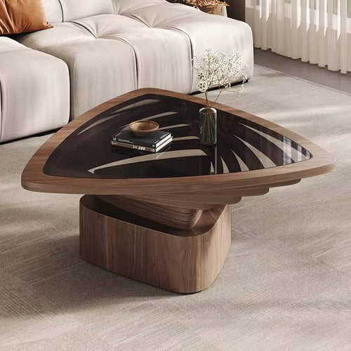 Modern wooden coffee table with a glass top in a living room