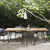 Wicker chairs around garden dining table