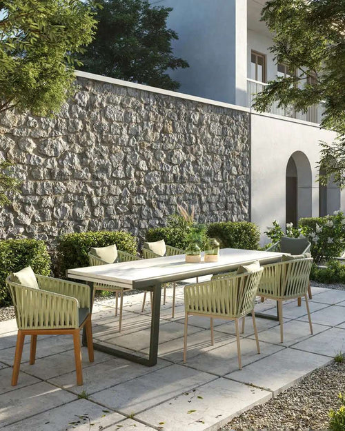 Yuno Wicker green chair set in outdoor area.