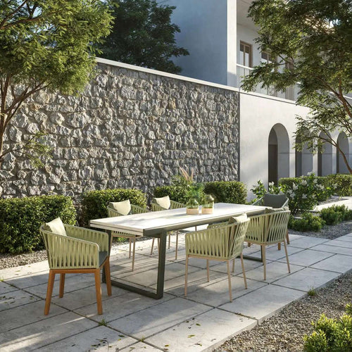 Yuno Wicker green chair set in outdoor area.