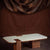 Japandi coffee table with travertine marble top and wooden base in walnut finish