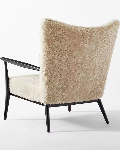 Back view of Zephyr boucle lounge chair.