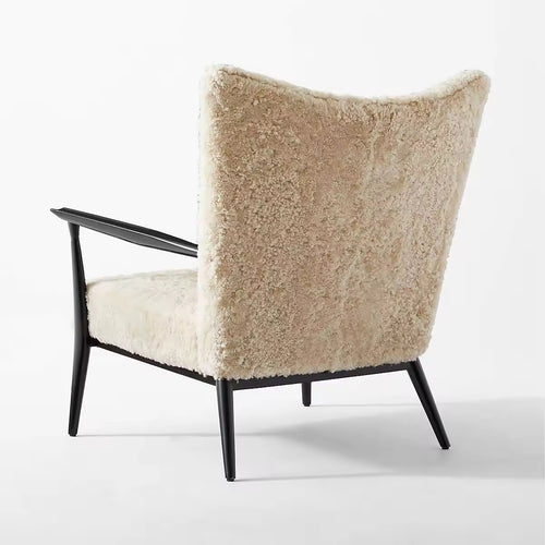 Back view of Zephyr boucle lounge chair.