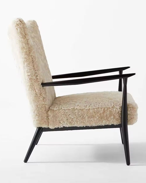 Side profile of Zephyr chair with winged back and black arms