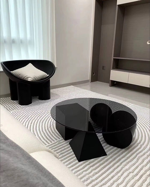 Black round coffee table in modern interior 