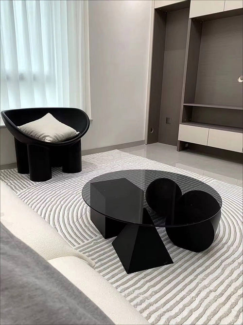 Black round coffee table in modern interior 