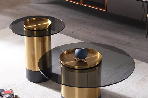 Two modern side tables with gold and black finish.