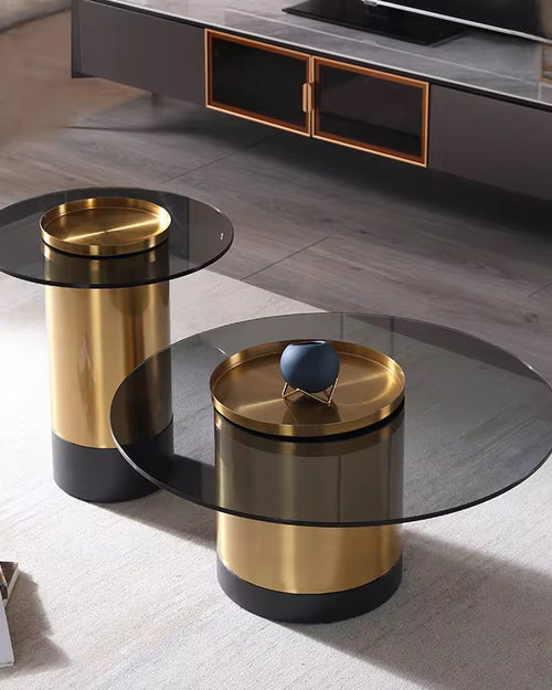 Two modern side tables with gold and black finish.
