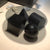Modern black and glass coffee table with abstract design