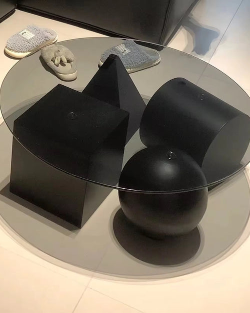 Modern black and glass coffee table with abstract design