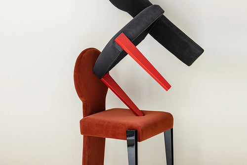Koina Chair in red with black backrest and contrasting design