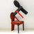 Koina Chair in red with black backrest and contrasting design
