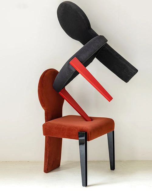 Koina Chair in red with black backrest and contrasting design