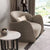 Modern beige armchair in a living room 