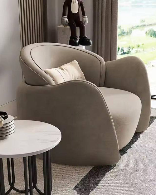 Modern beige armchair in a living room 