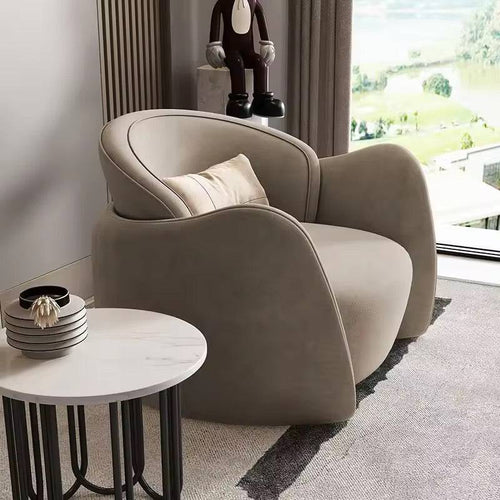 Modern beige armchair in a living room 