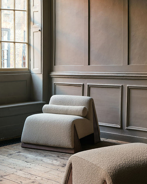Beige modern armchair and ottoman