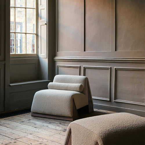 Beige modern armchair and ottoman