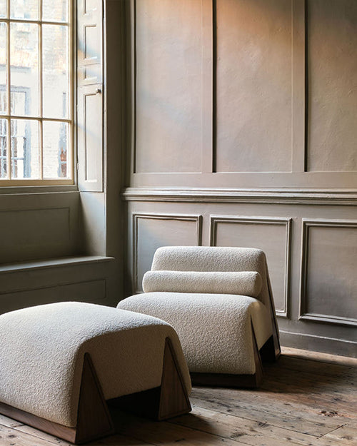 Modern chair and ottoman set in a room 