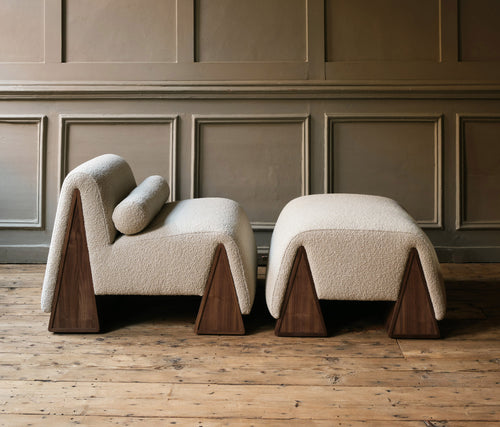 Two modern chairs with wooden legs 